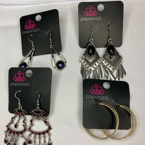Four pairs of earrings, black and silver, blue and silver, gold, hoops, and red